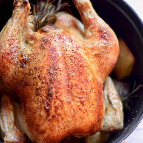 completed whole roasted chicken in dutch oven