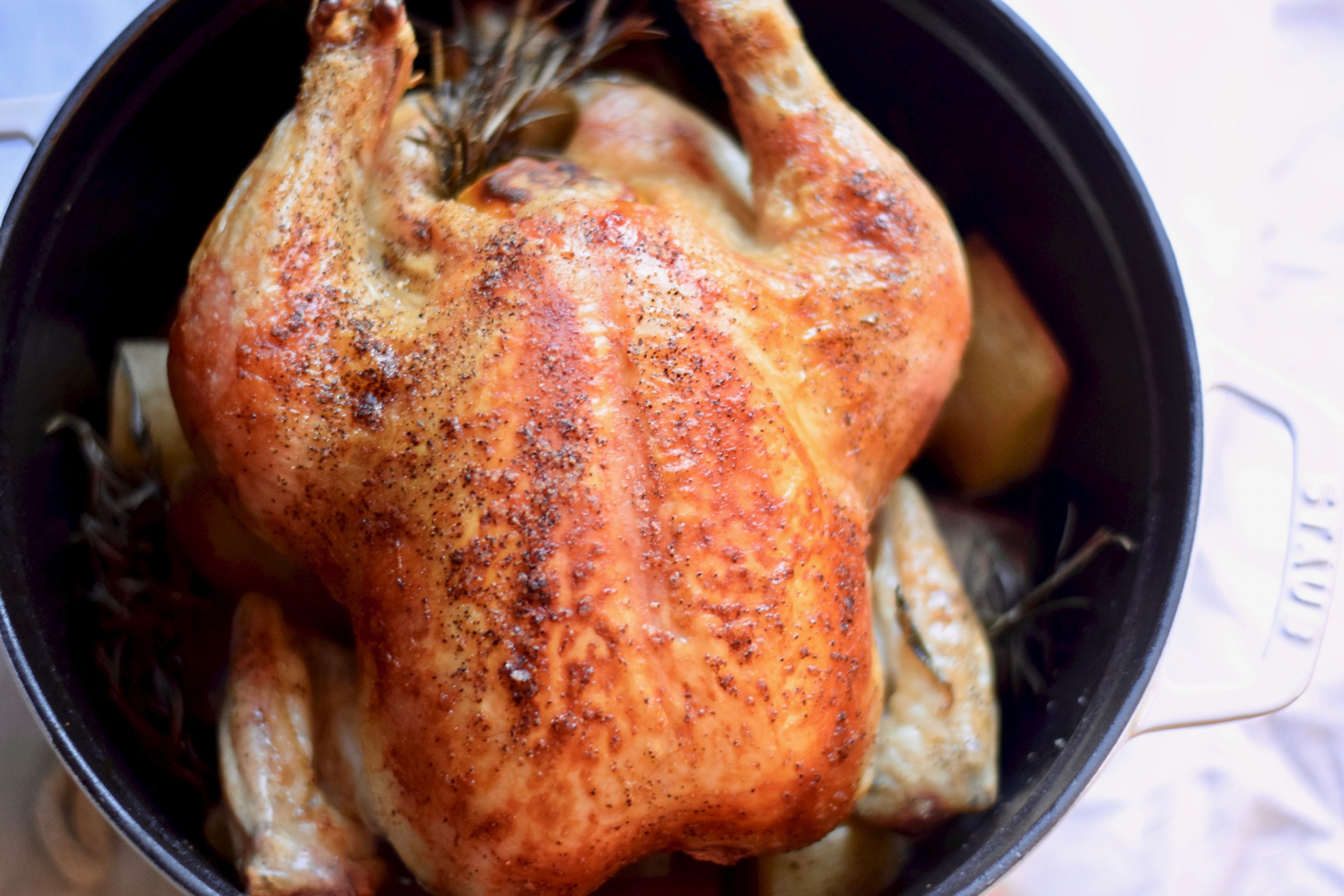 completed whole roasted chicken in dutch oven
