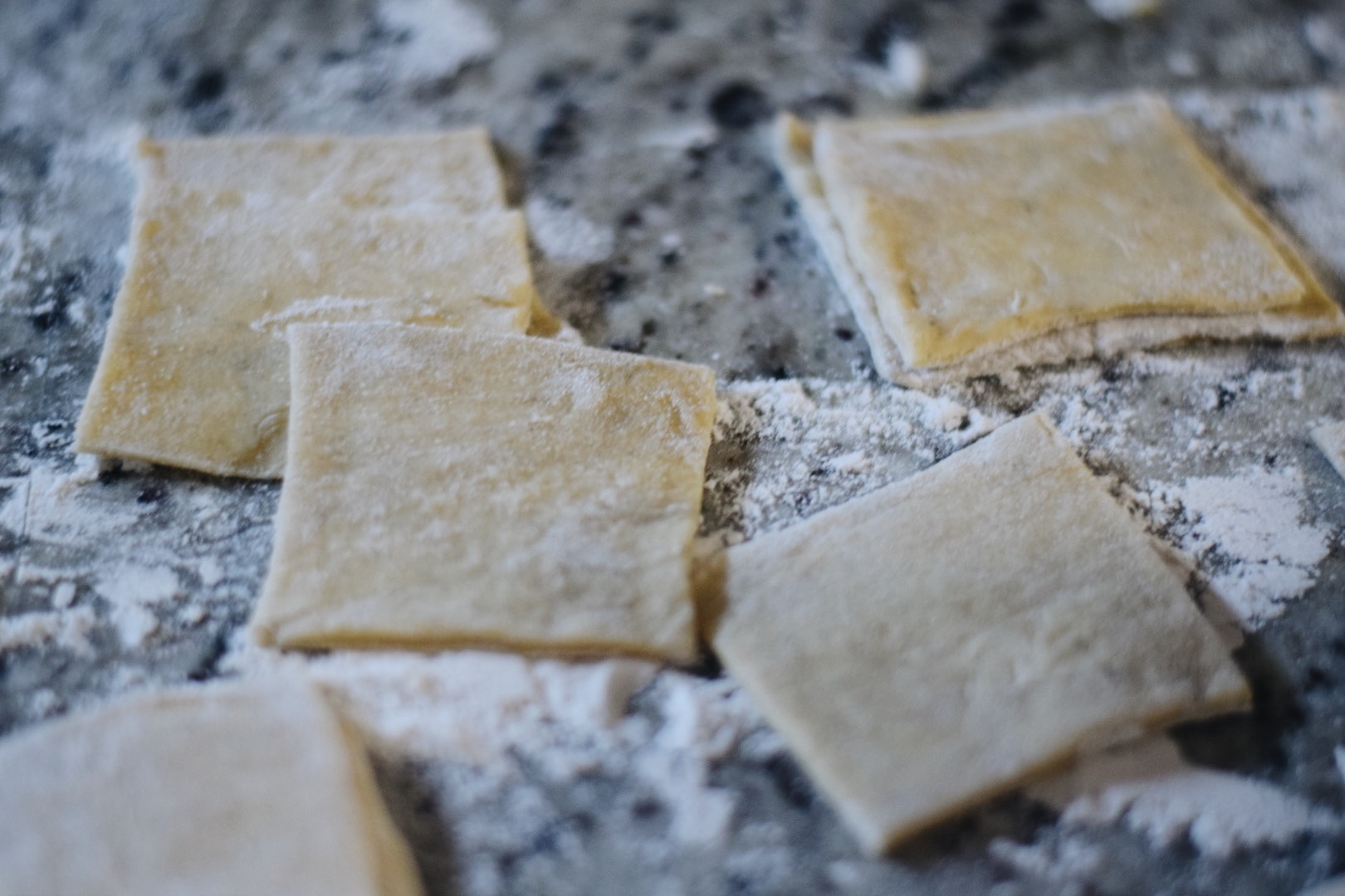 ravioli dough without filling on a floured surface