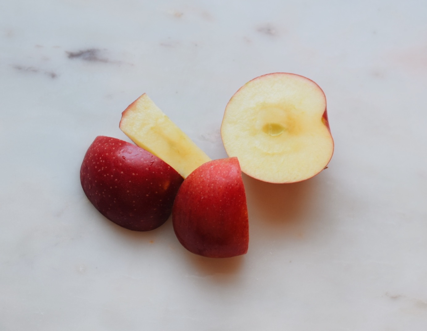 chopped apple on white surface 