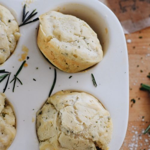 rosemary beer bread muffins in a white muffin tin